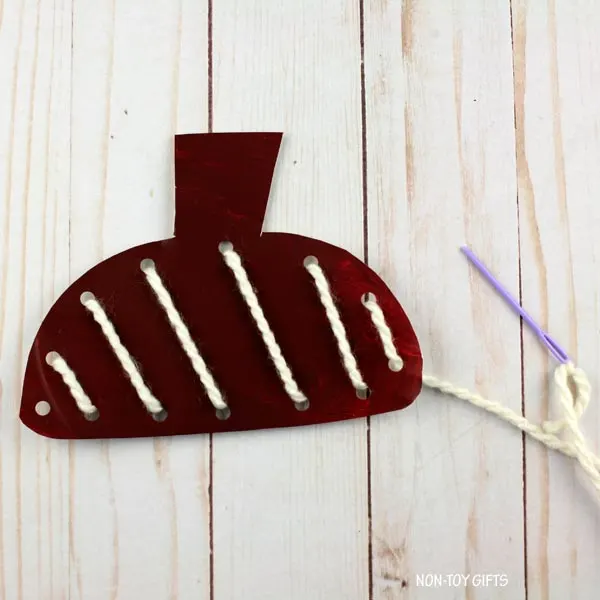thread yarn through holes
