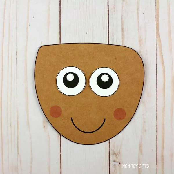 glue the eyes onto the acorn
