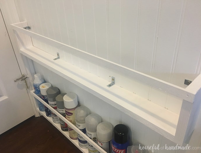 Build the ideal DIY paint organizer using leftover materials or inexpensive lumber. These paint shelves can also be mounted inside closets or behind doors, creating even more free space. Housefulofhandamde.com | $100 Room Challenge | Spray Paint Organizer | Craft Paint Storage | Craft Space Organization | Scrap Wood Project Plans | Free Building Plans | DIY Storage Ideas | Craft Room Transformation | Office Makeover