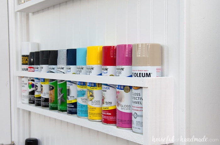 Create the perfect DIY paint storage from scraps or cheap wood. The paint storage shelves can even be hung in closets or behind doors to free up even more space. Housefulofhandamde.com | $100 Room Challenge | Spray Paint Storage | Craft Paint Storage | Craft Room Organization | Scrap Wood Build Plans | Free Build Plans | DIY Storage Solutions | Craft Room Makeover | Office Makeover