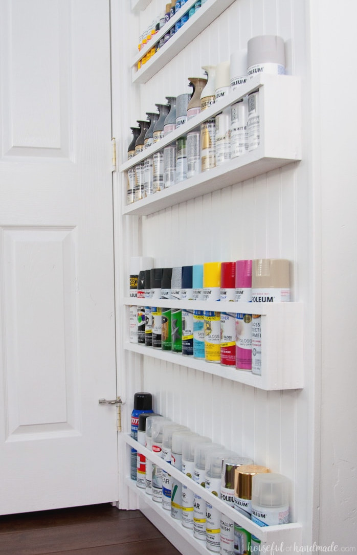 Create the perfect DIY paint storage from scraps or cheap wood. The paint storage shelves can even be hung in closets or behind doors to free up even more space. Housefulofhandamde.com | $100 Room Challenge | Spray Paint Storage | Craft Paint Storage | Craft Room Organization | Scrap Wood Build Plans | Free Build Plans | DIY Storage Solutions | Craft Room Makeover | Office Makeover