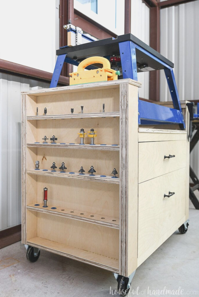 Plywood rolling cart made to hold a Kreg bench top router, with large drawers and router bit storage.