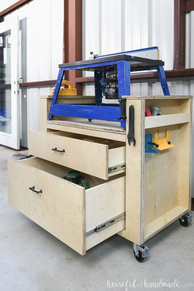 The two large drawers beneath the router are shown open.