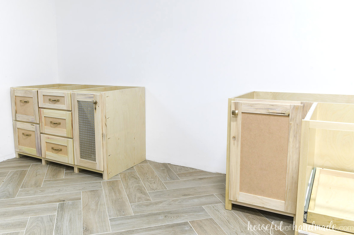 Cabinets for a built in desk fitted before the desktop has been installed.