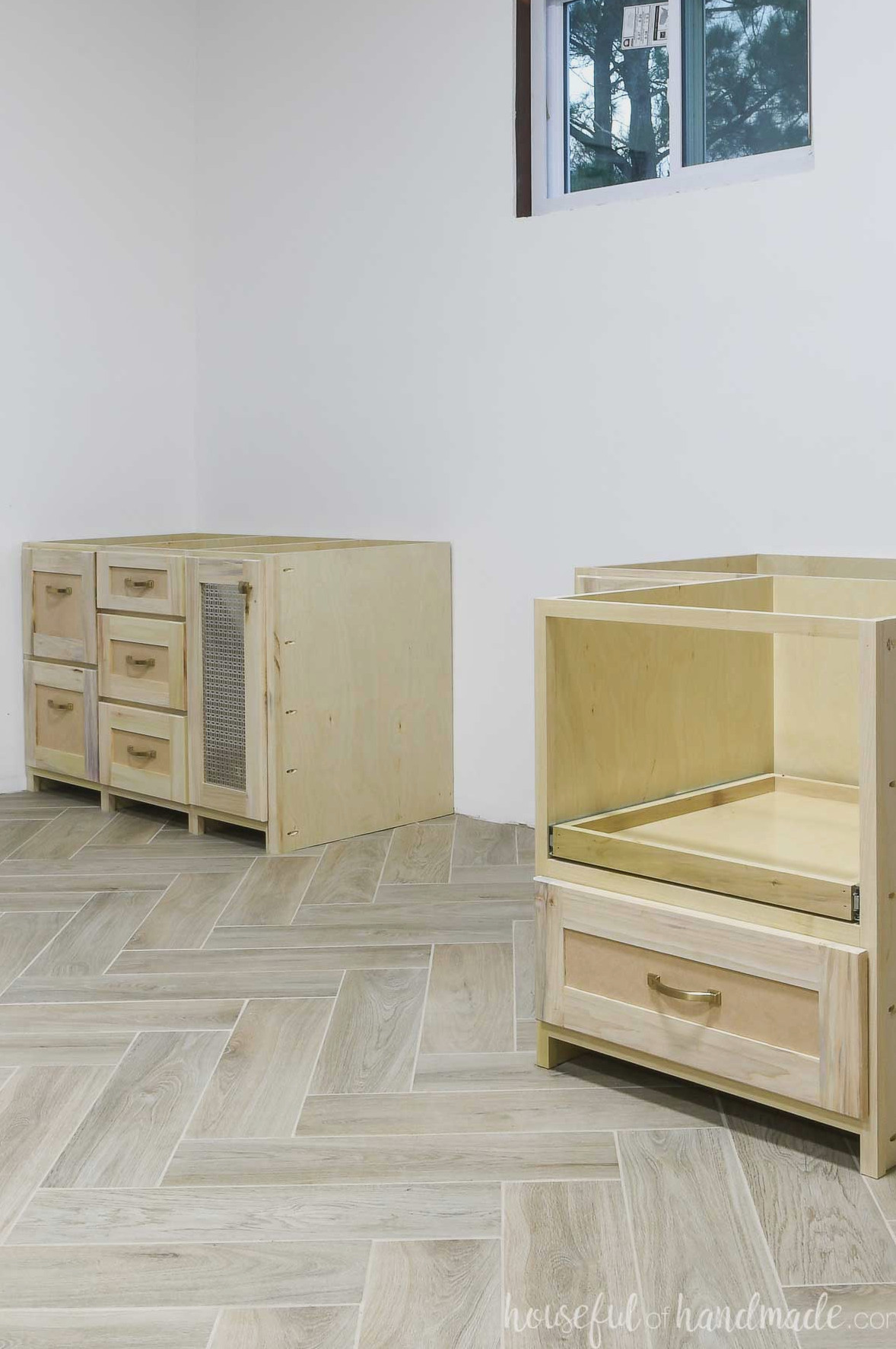 DIY built-in desk cabinets positioned along the office wall.