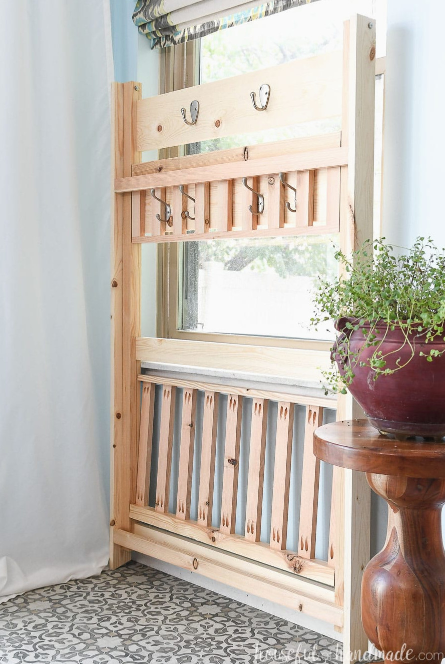 The collapsible mudroom storage shelves folded flat and ready to be stored.