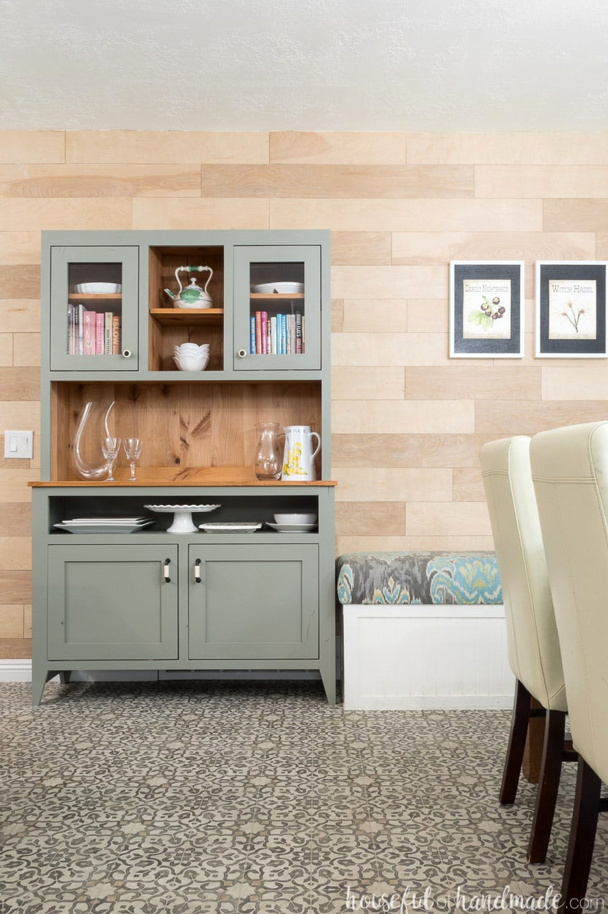 Dining room featuring patterned vinyl flooring, a built in bench, and a 4' wide gray rustic dining room hutch.
