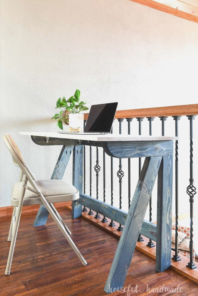 Basic DIY desk that folds flat for storage when it is not being used.