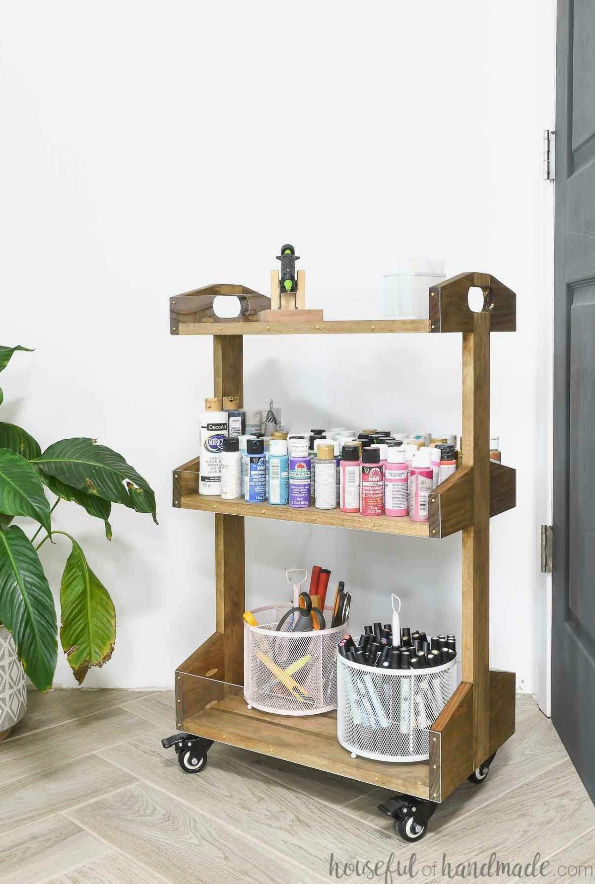 Simple wooden rolling cart with transparent fronts on all three trays.