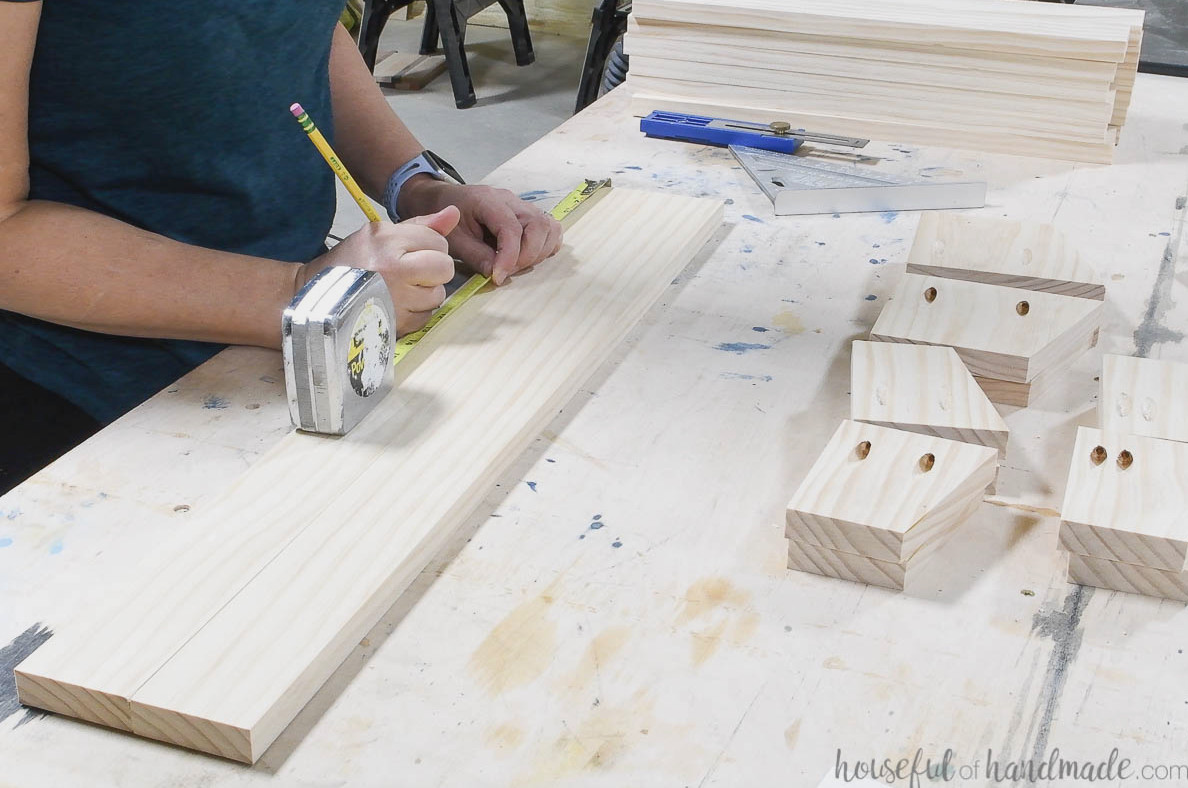 Marking the middle tier position on the center boards.