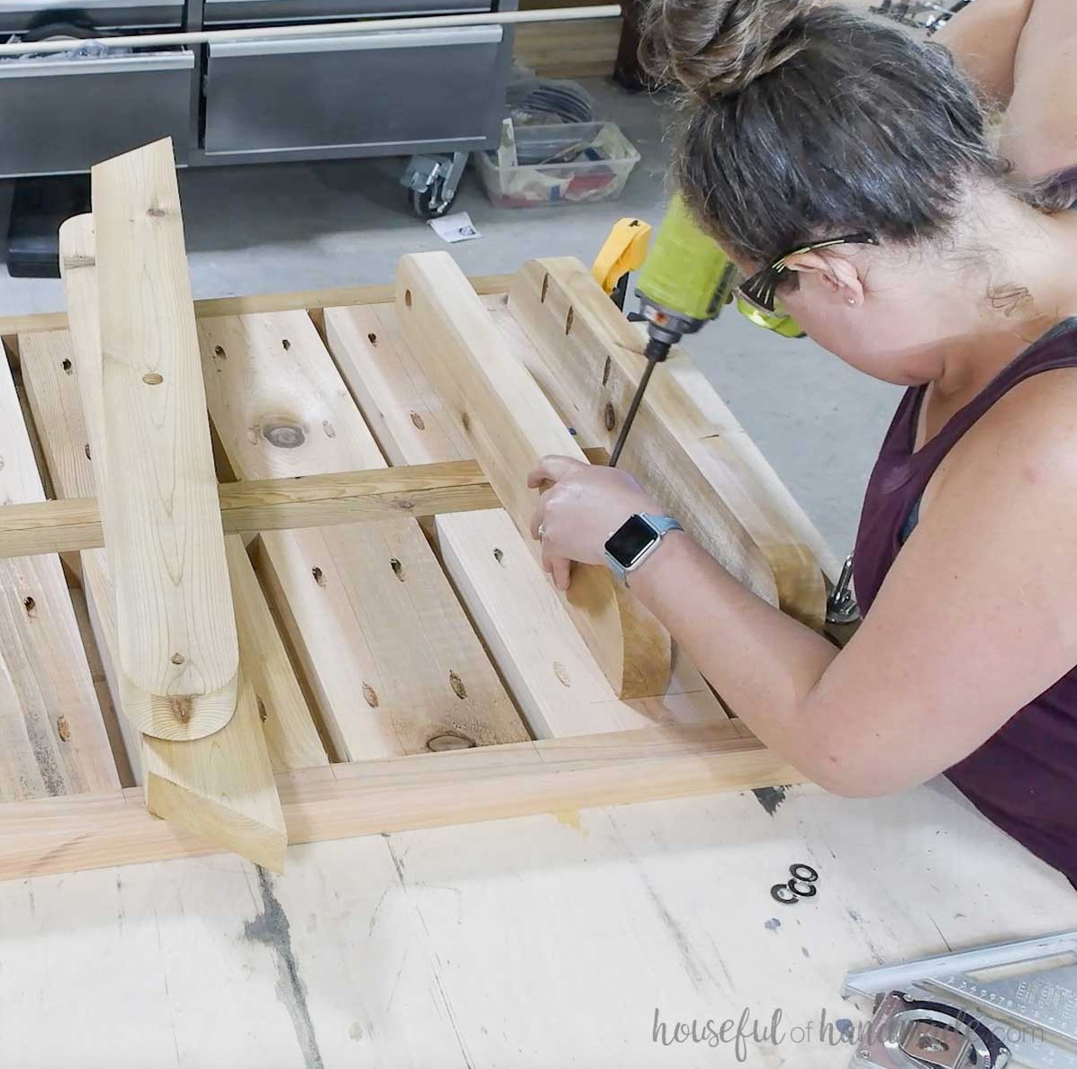 Fastening the upper leg pieces to the assembled table tops.
