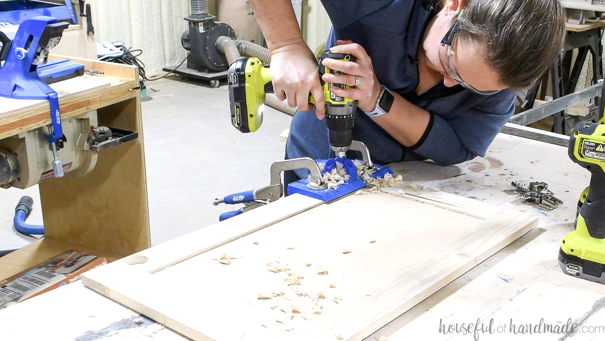Drilling holes in the cabinet doors for concealed hinges with the Kreg jig.