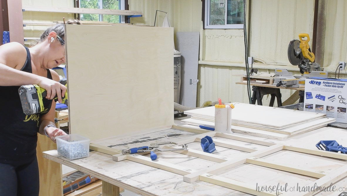 Securing the first cabinet side to the desk face frame.