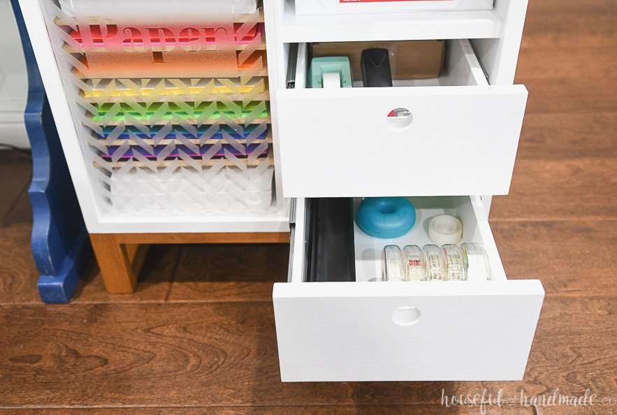 Compact printer table with 2 open drawers displaying the storage space.