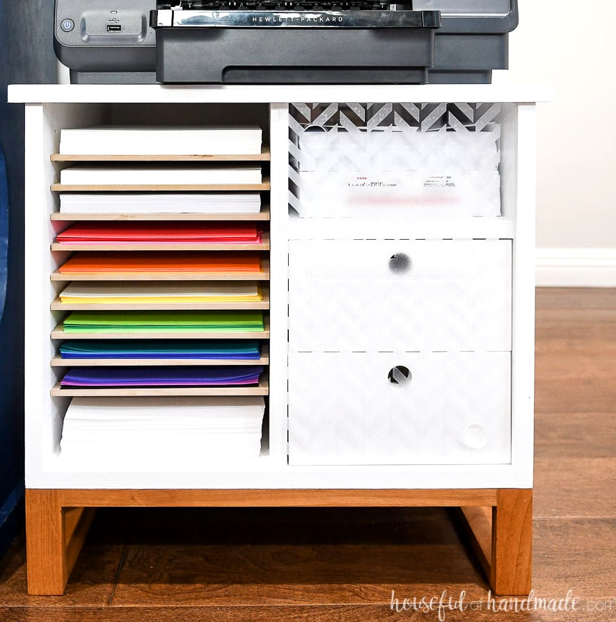 Square image of the printer stand featuring paper storage and drawers.