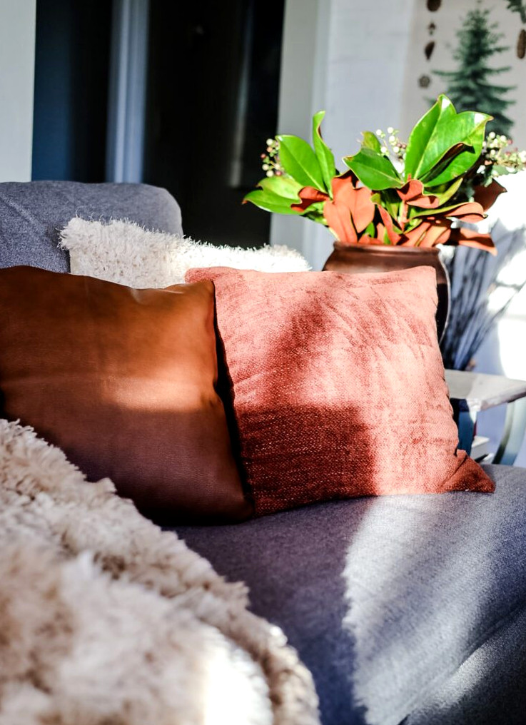 rust pillows on a gray couch