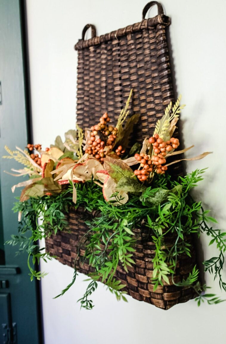 wall basket with fall flower picks and greenery