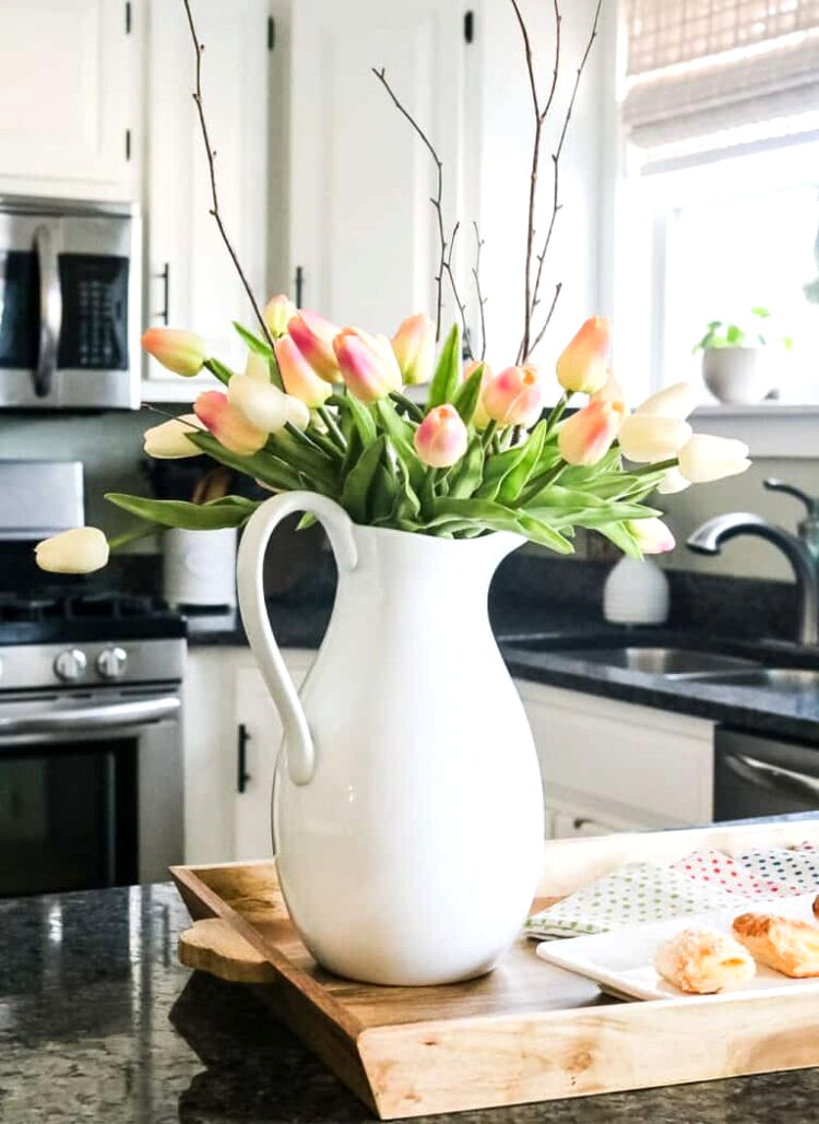spring kitchen with pitcher of tulips on counter