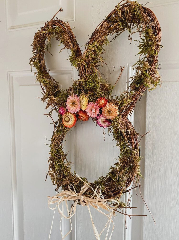 moss bunny head wreath on a front door