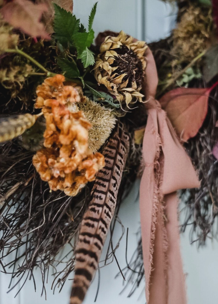 closeup of garden wreath with dried flowers
