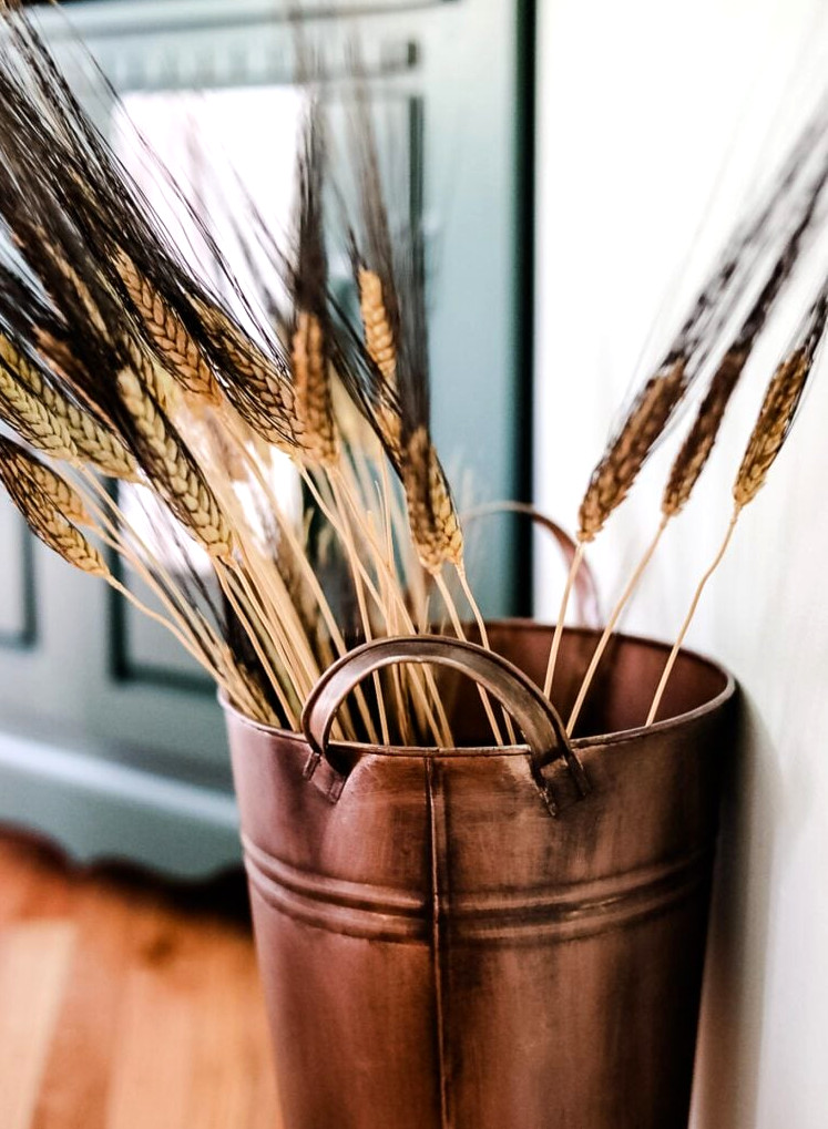 copper bucket with wheat