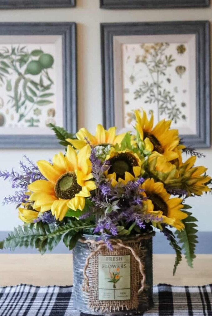 SUNFLOWER ARRANGEMENT IN RUSTY CONTAINER