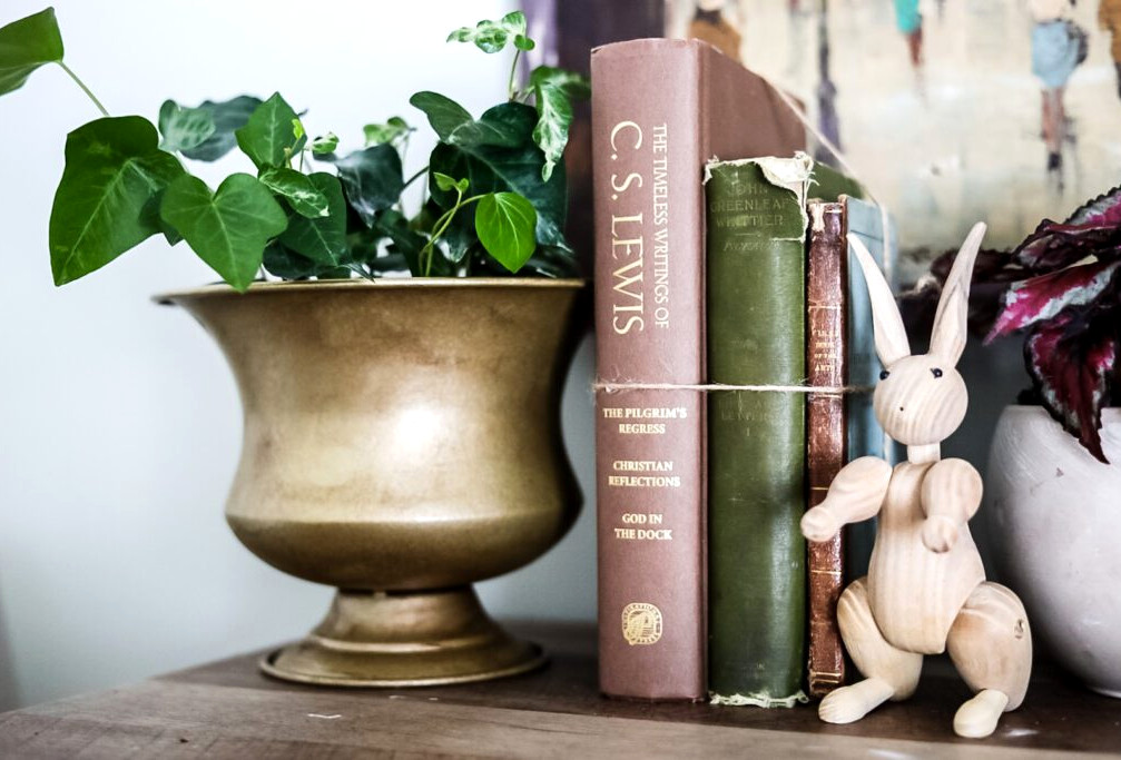 brass planter and vintage books