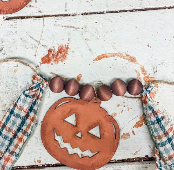making a pumpkin garland