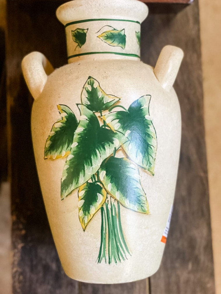 thrifted vase decorated with painted foliage