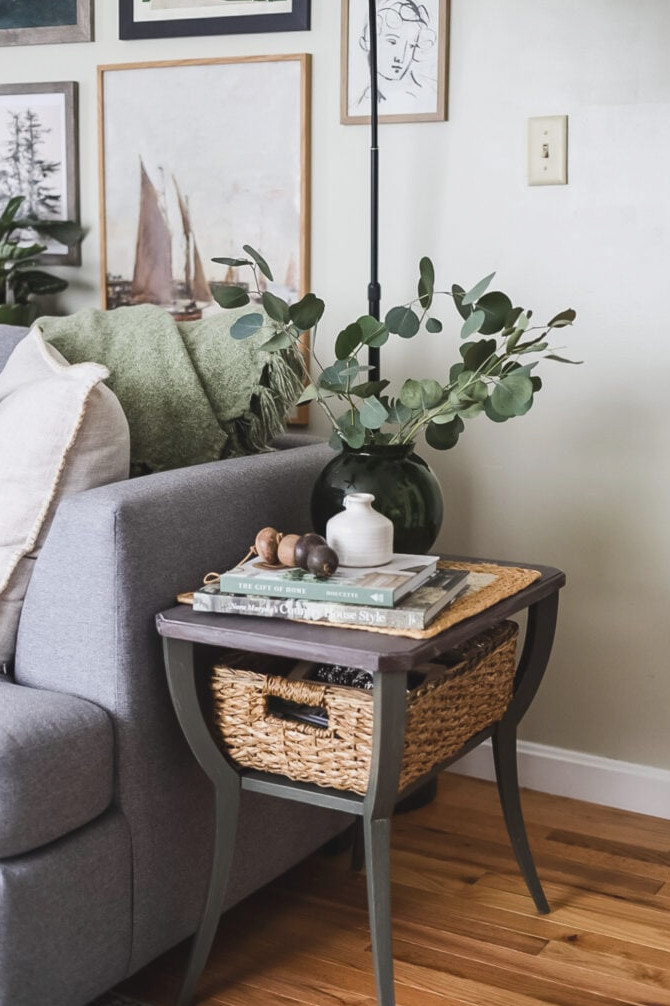 side table with green vase and books