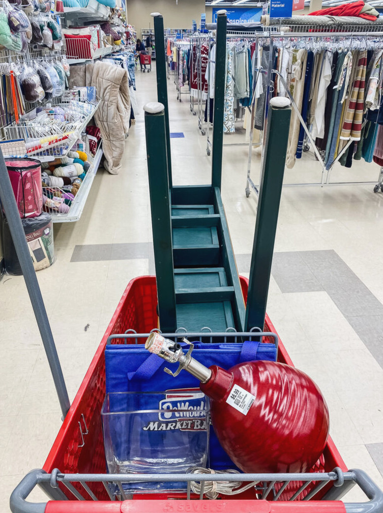 a shopping cart filled with thrift store finds
