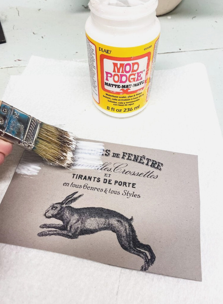 applying Mod Podge to a print