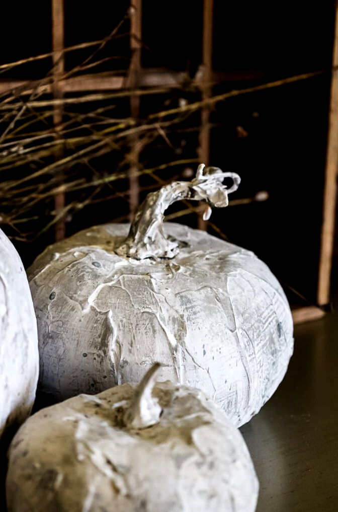 fake cement pumpkin display