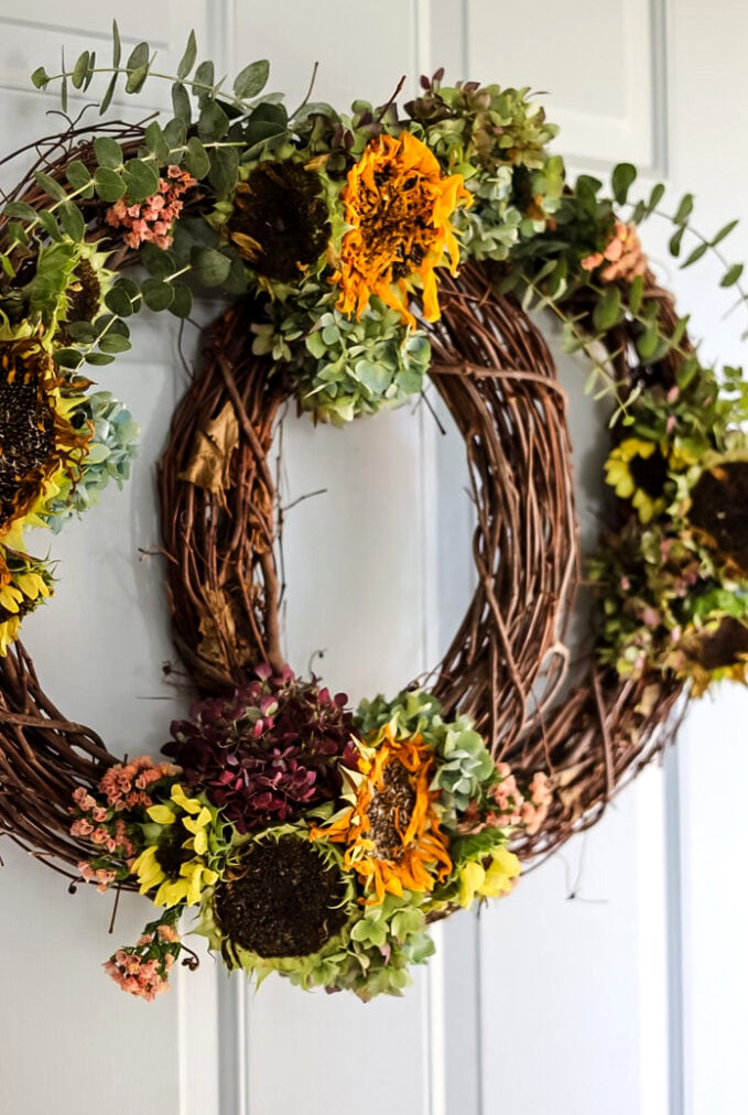 grapevine pumpkin shaped wreath with fresh flowers