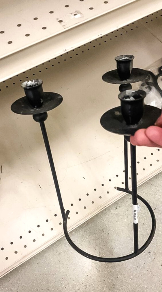 black thrift store candlesticks