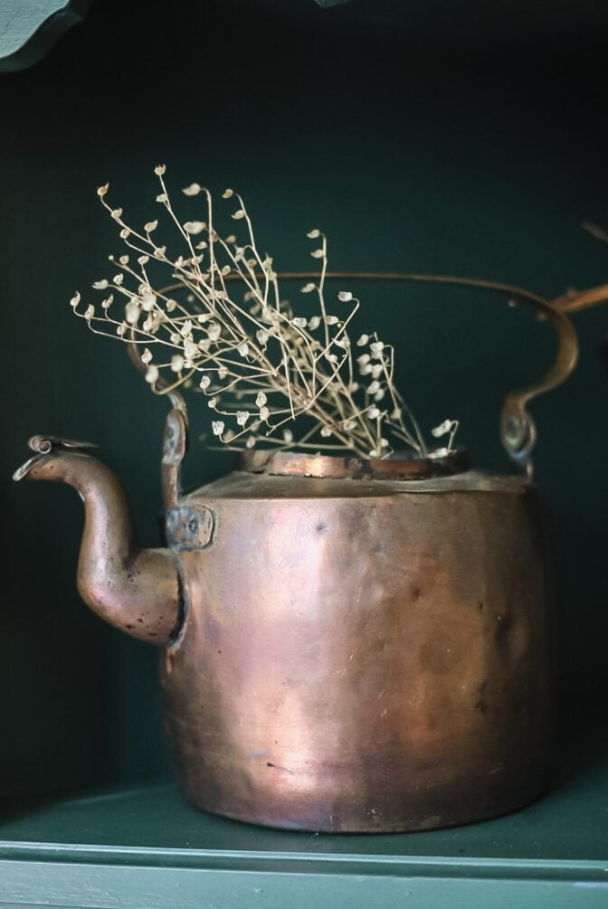copper kettle with dried flowers