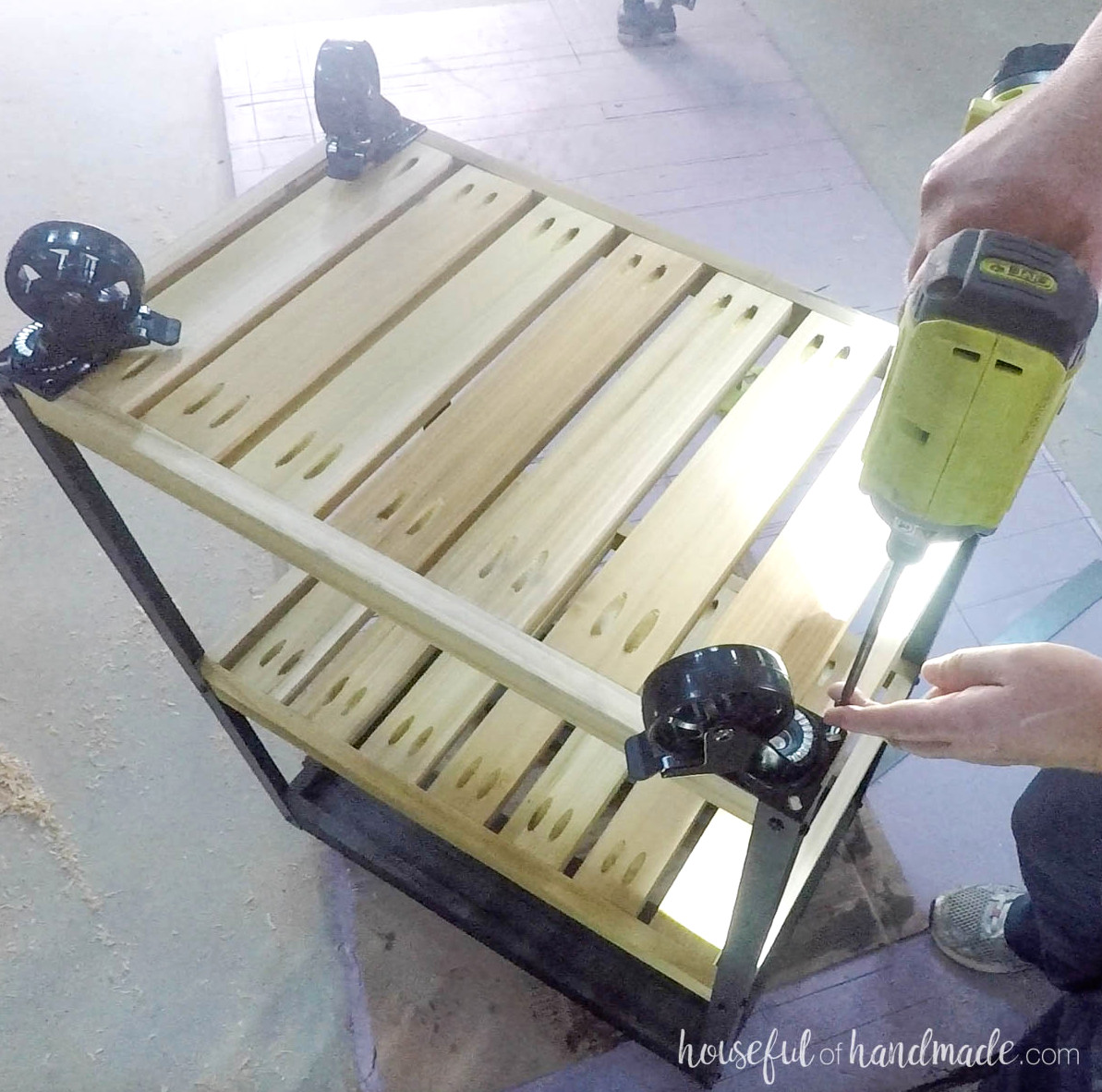 Adding castors to the bottom of the cart. 