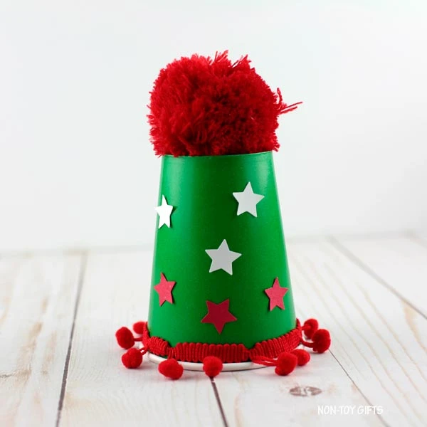 place a large pom pom on top
