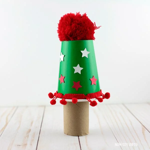 join the paper cup to the paper roll with glue