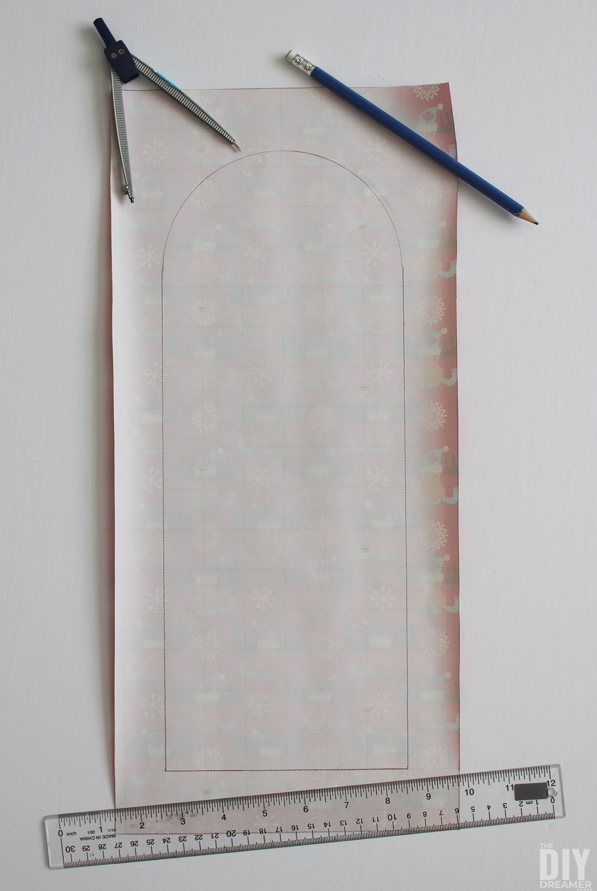 Lantern template drawn on grid wrapping paper.