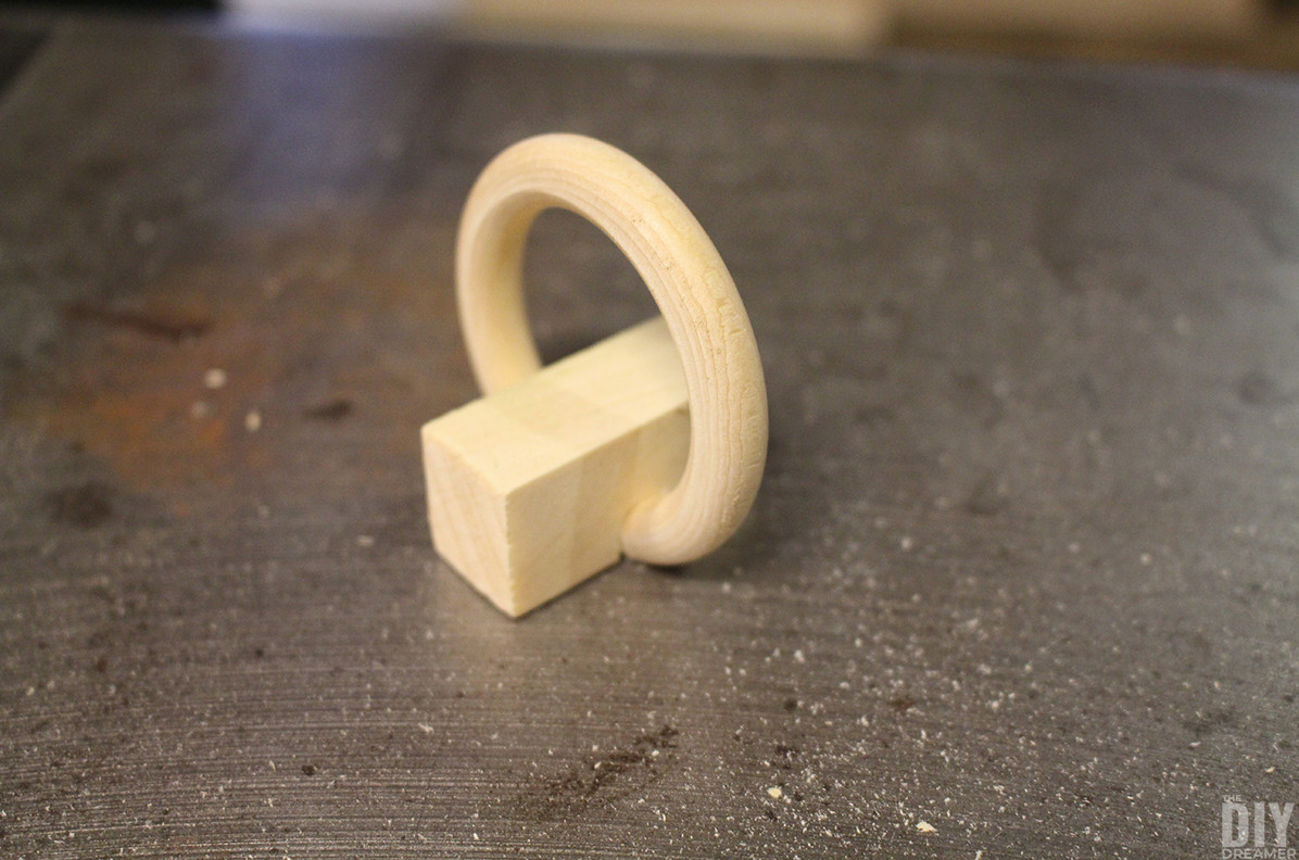 Wooden ring fitted inside a block.