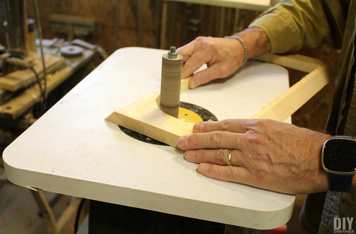 Smoothing the inside edges with a spindle sander.