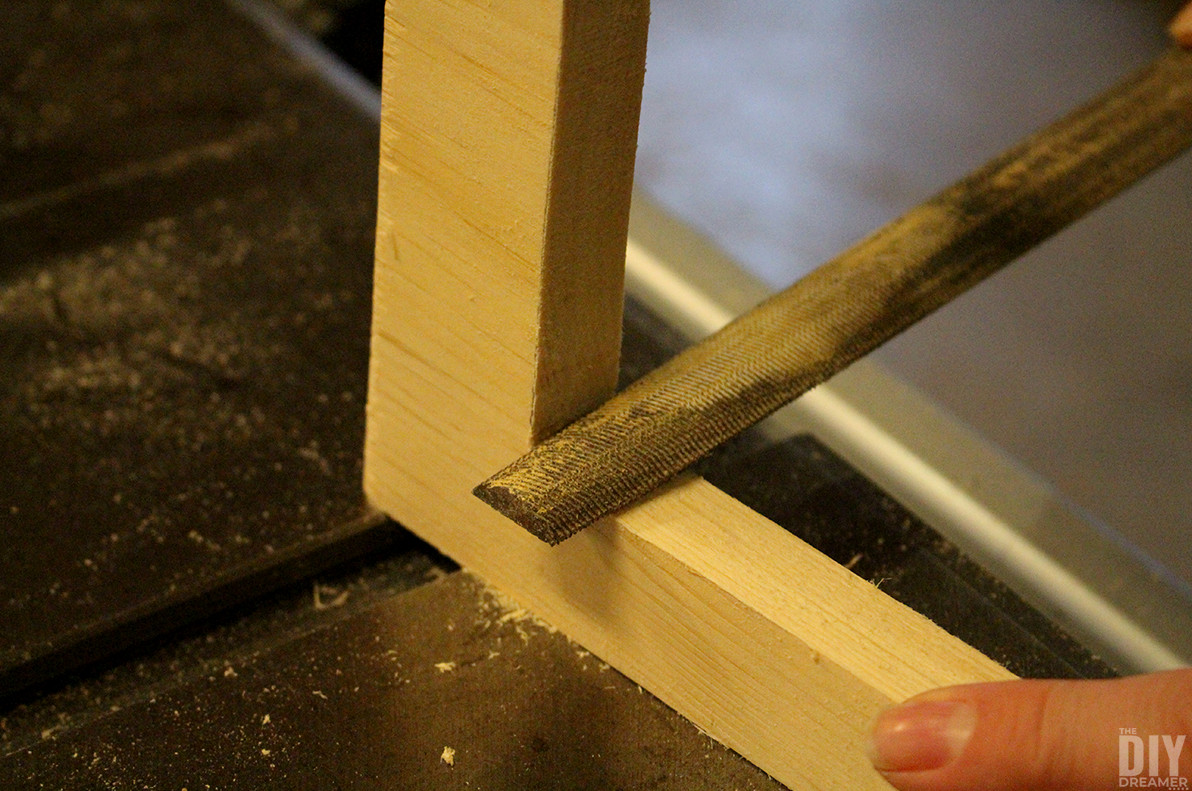 Straightening the corners with a wood file.