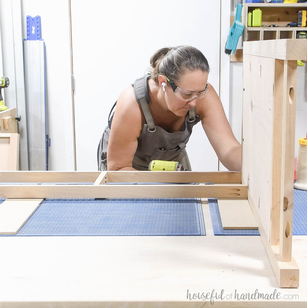 Attaching the front frame to one of the dresser side pieces.