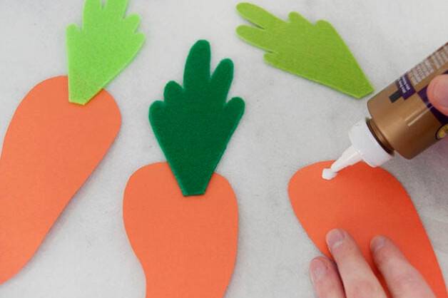 Securing carrot tops to carrots