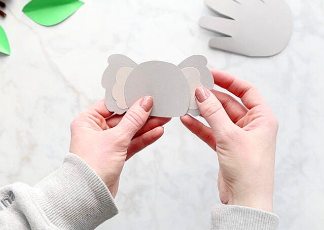 Gluing ear to koala head