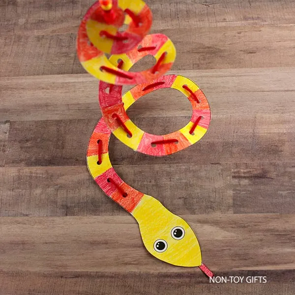 printable spiral paper and yarn snake activity for children to make during the Year of the Snake