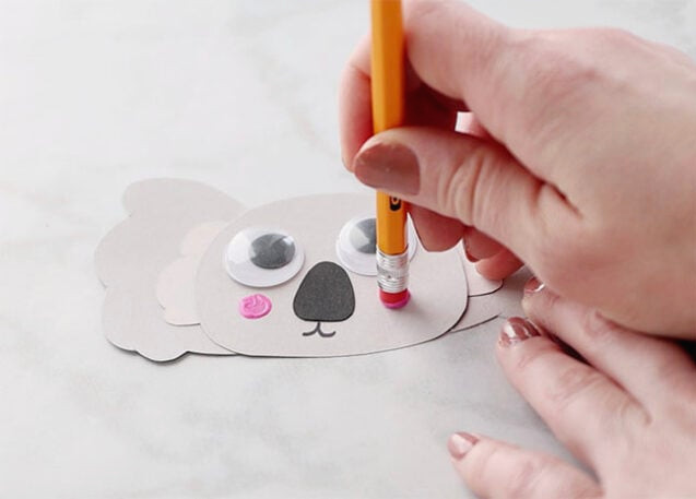 Stamping cheeks onto koala