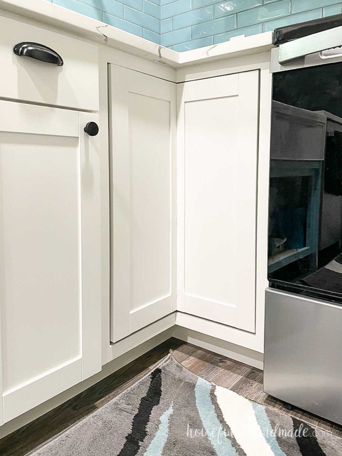 Base corner kitchen cabinet with an inset door mounted to the turntable inside.