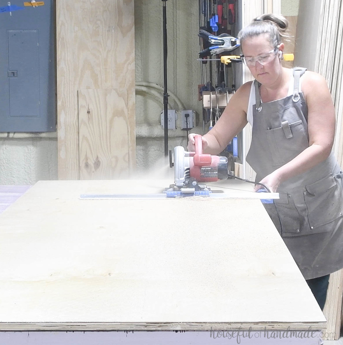 Ripping strips of plywood for the cabinet sides with a circular saw. 